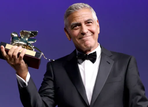 George Clooney giving a speech at the Venice Film Festival.