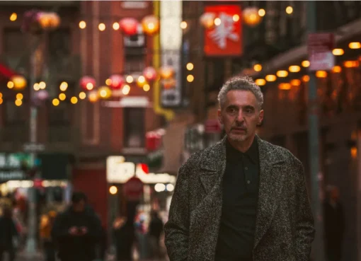 Actor John Turturro looking thoughtful at a film event.