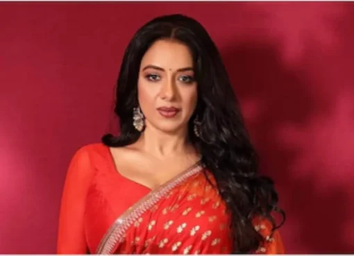 Rupali Ganguly smiling, looking confident.