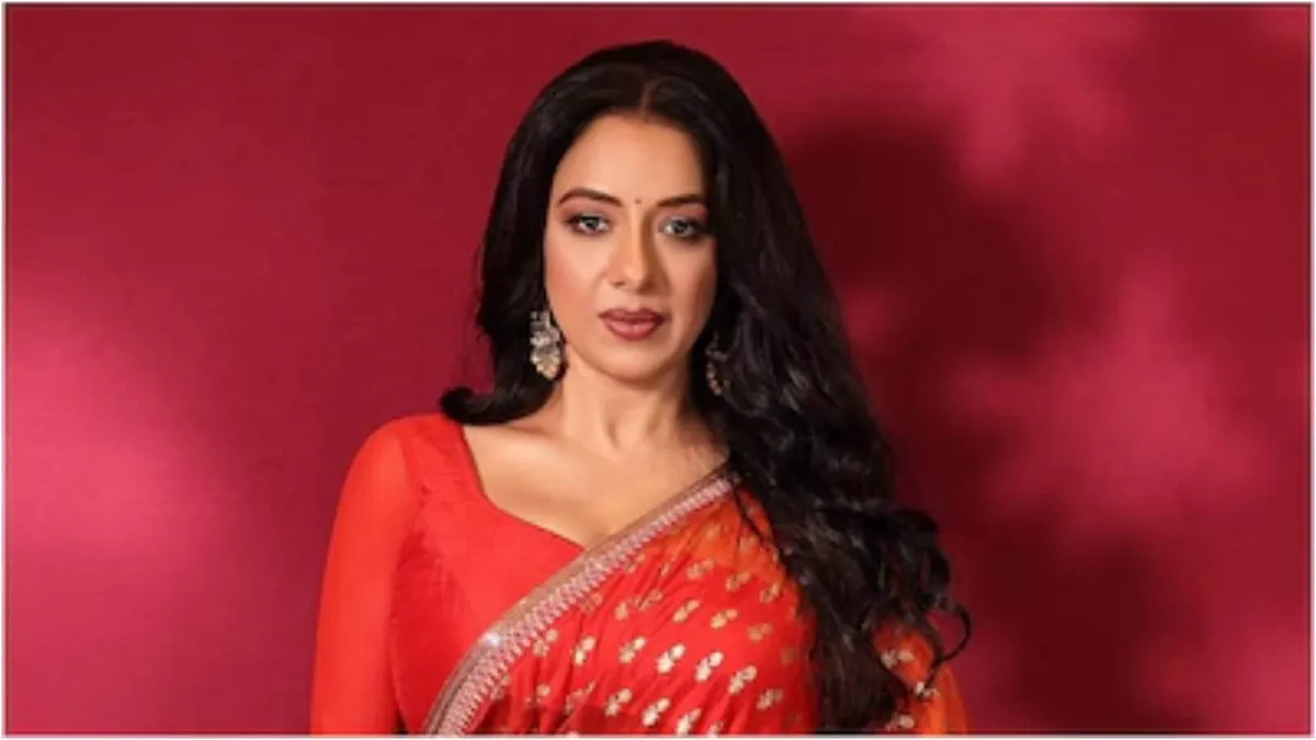 Rupali Ganguly smiling, looking confident.