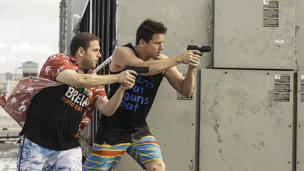 Hugh Jackman looking adventurous with a pirate ship behind him, next to a '24 Jump Street' logo.
