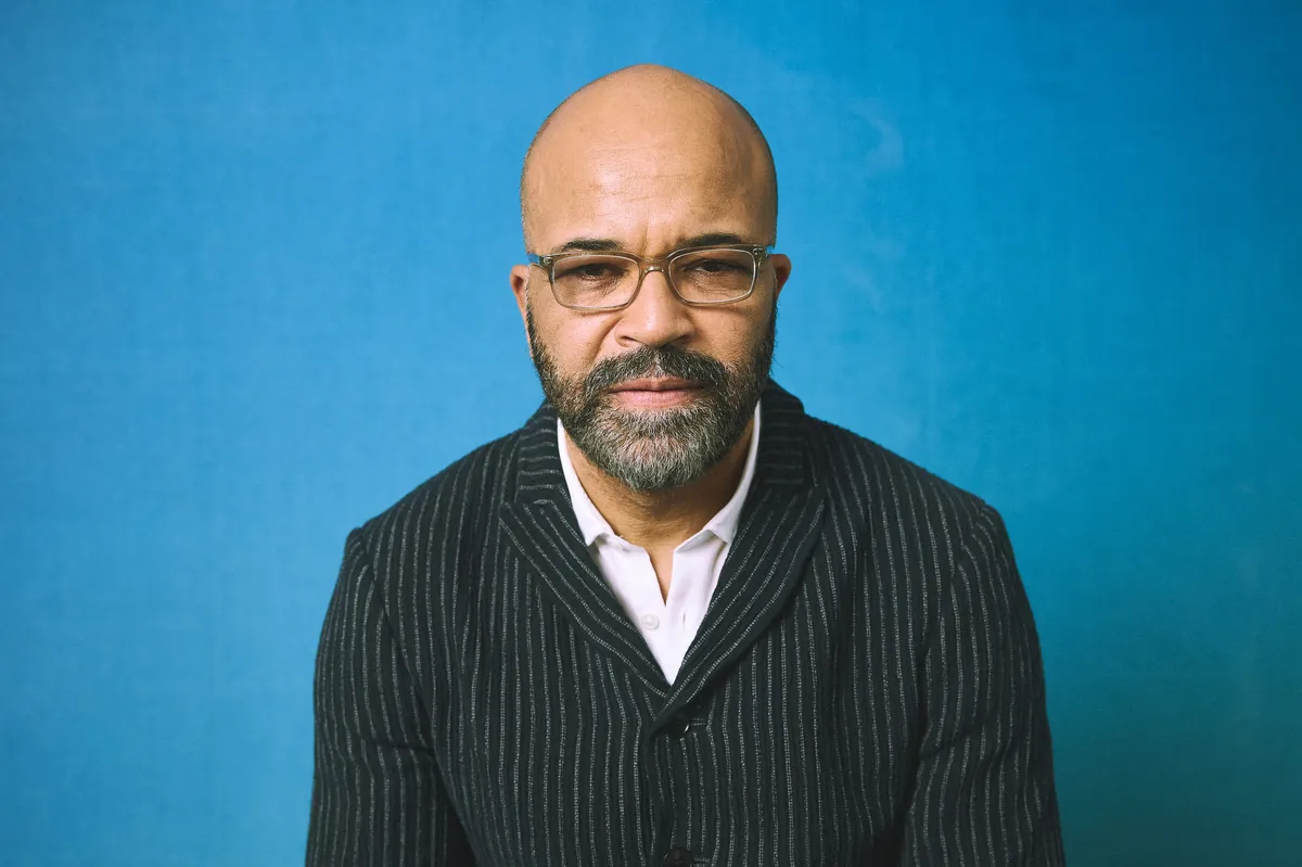 Actor Jeffrey Wright holding a lacrosse stick in a promotional video.