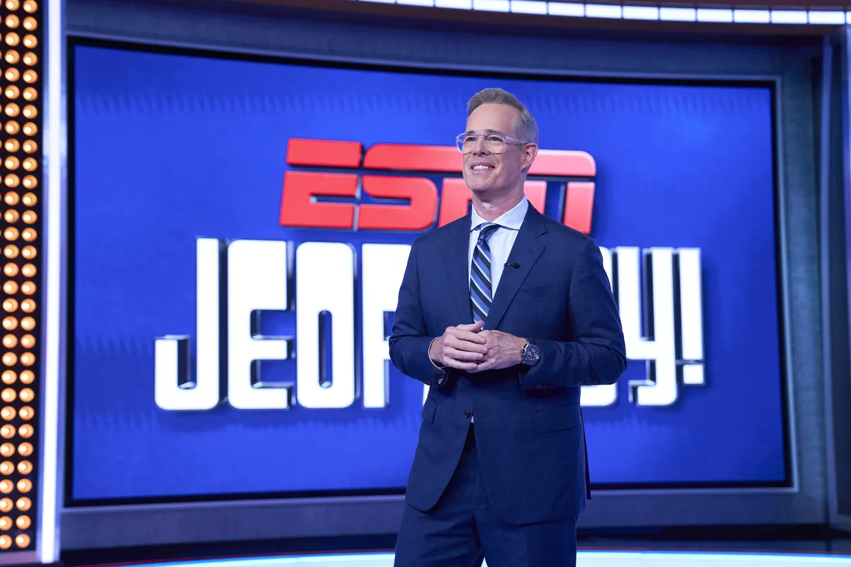 The ESPN Jeopardy! logo with a sports-themed background.