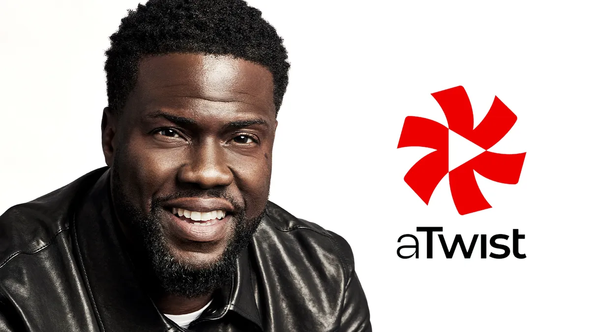 Kevin Hart smiling with a production crew.