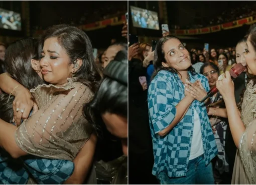 Lilly Singh smiling brightly next to singer Shreya Ghoshal backstage at a concert.