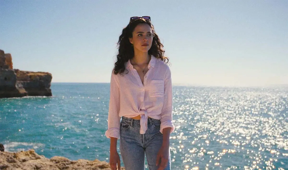 Margaret Qualley in a thoughtful pose from 'Love of Your Life', looking serious.