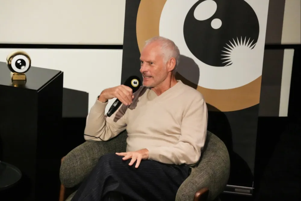 Martin McDonagh smiling and talking at a film festival, likely at Zurich.