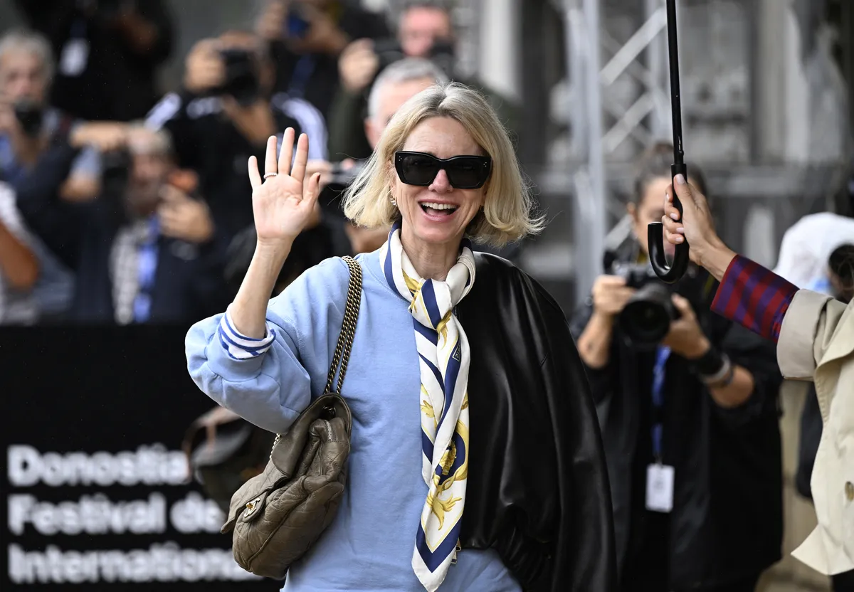 Naomi Watts smiling and speaking at the San Sebastián Film Festival press conference.