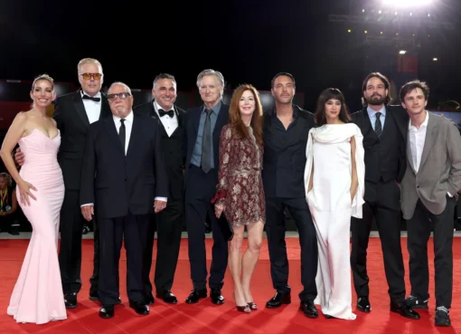 Paul Schrader looking emotional with Jack Huston patting his back at the Venice Film Festival premiere.