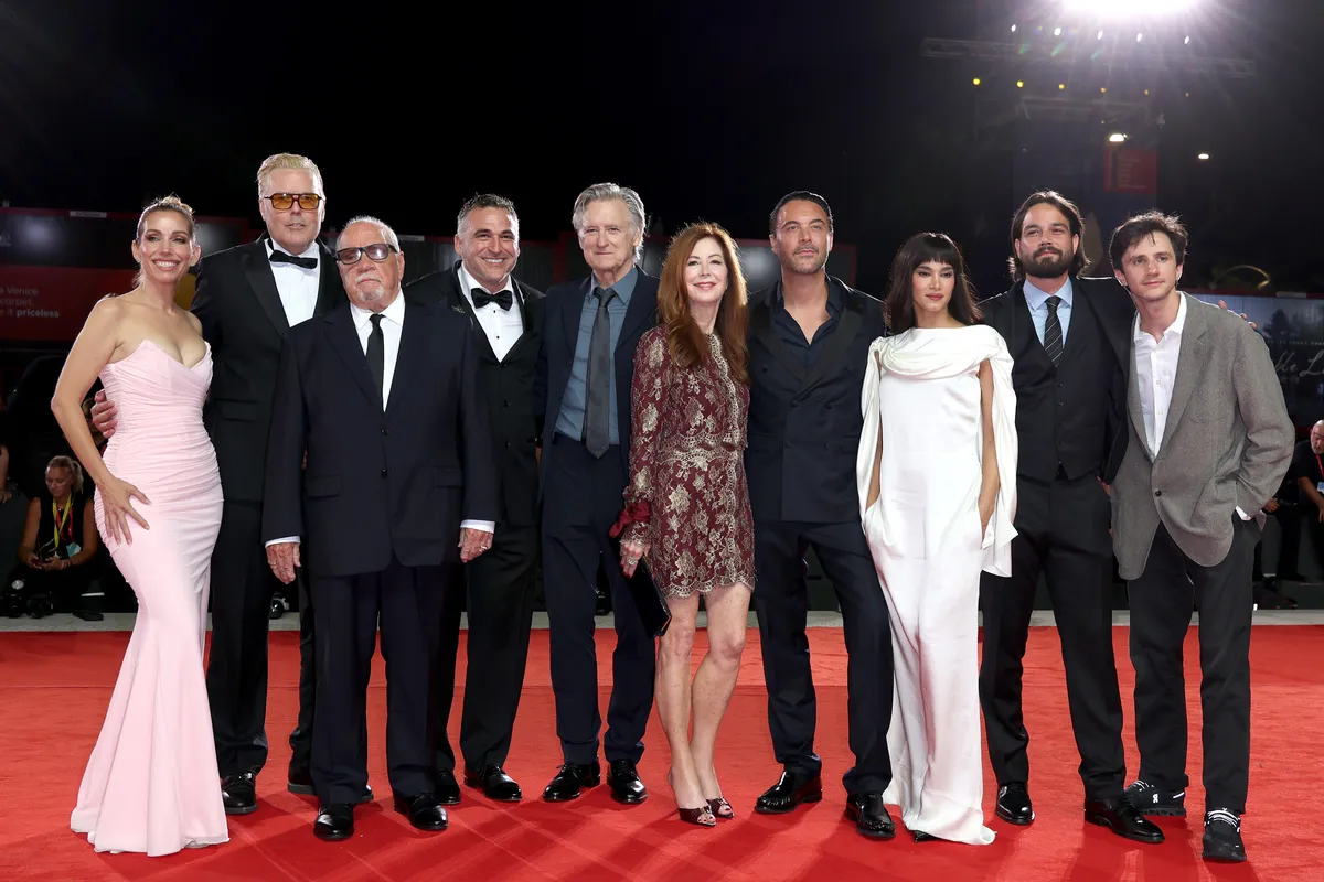 Paul Schrader looking emotional with Jack Huston patting his back at the Venice Film Festival premiere.