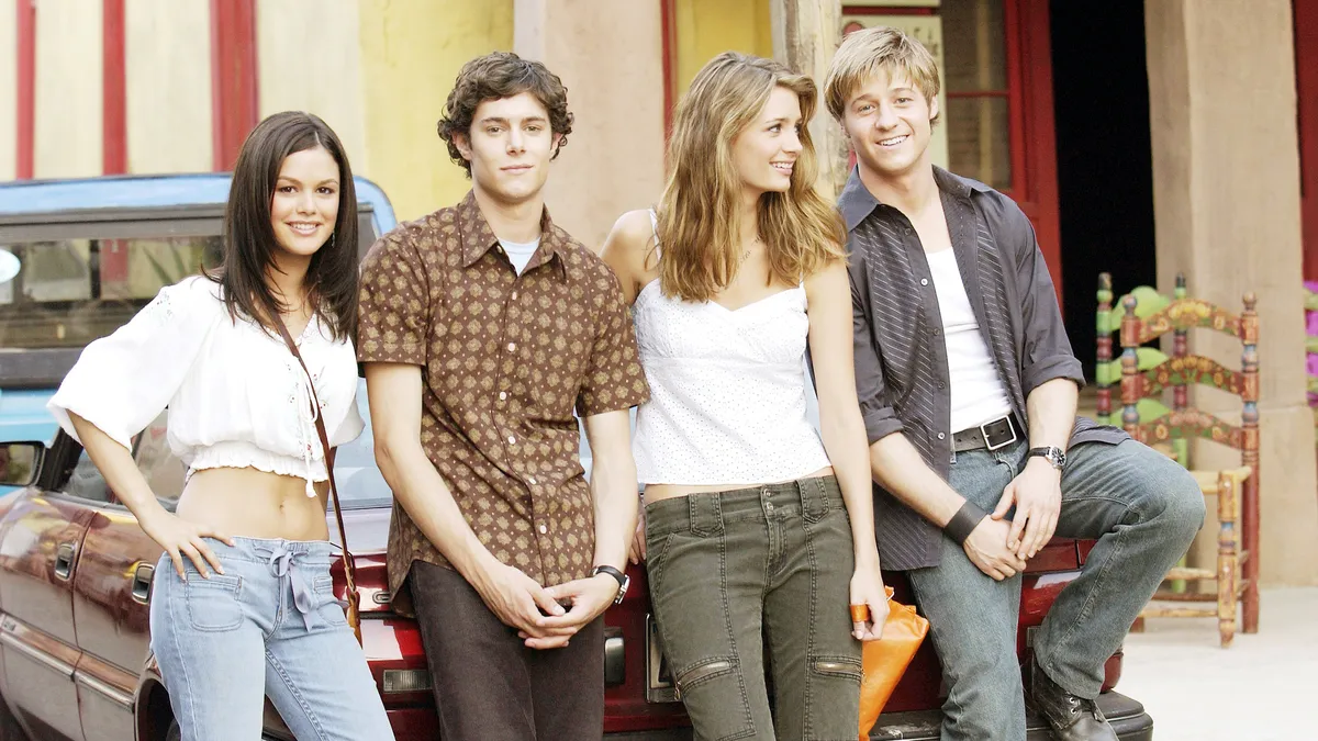 Ben McKenzie smiling in a casual setting.