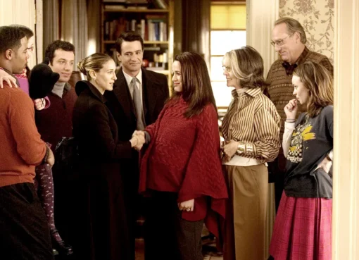 The ensemble cast of The Family Stone smiling together in a festive, cozy setting.