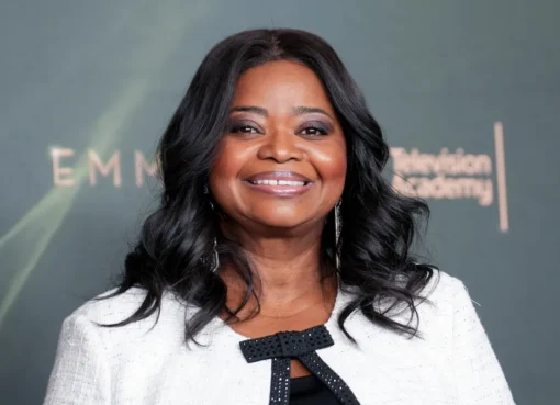 Octavia Spencer holding her Emmy award.