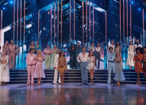 A group of dancers on a ballroom stage.