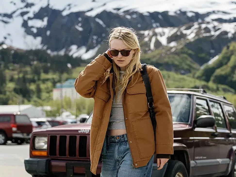 Dakota Fanning and Jake Johnson in a movie scene.