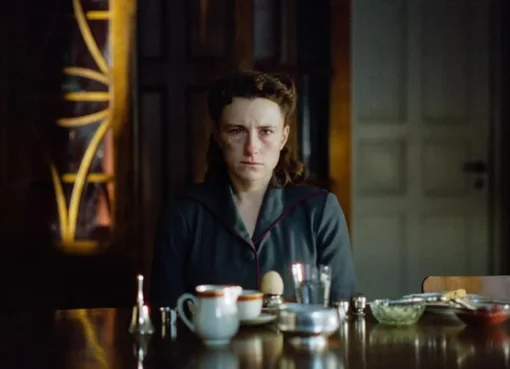 A still from the film 'Woman Unknown' featuring actress Mathilde Arcel in character.