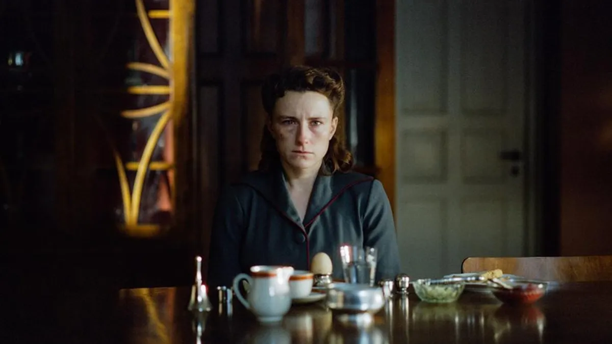 A still from the film 'Woman Unknown' featuring actress Mathilde Arcel in character.