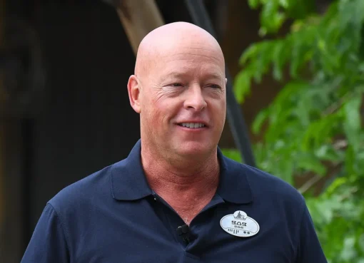 Bob Chapek looking serious, possibly with a Disney castle in the background.