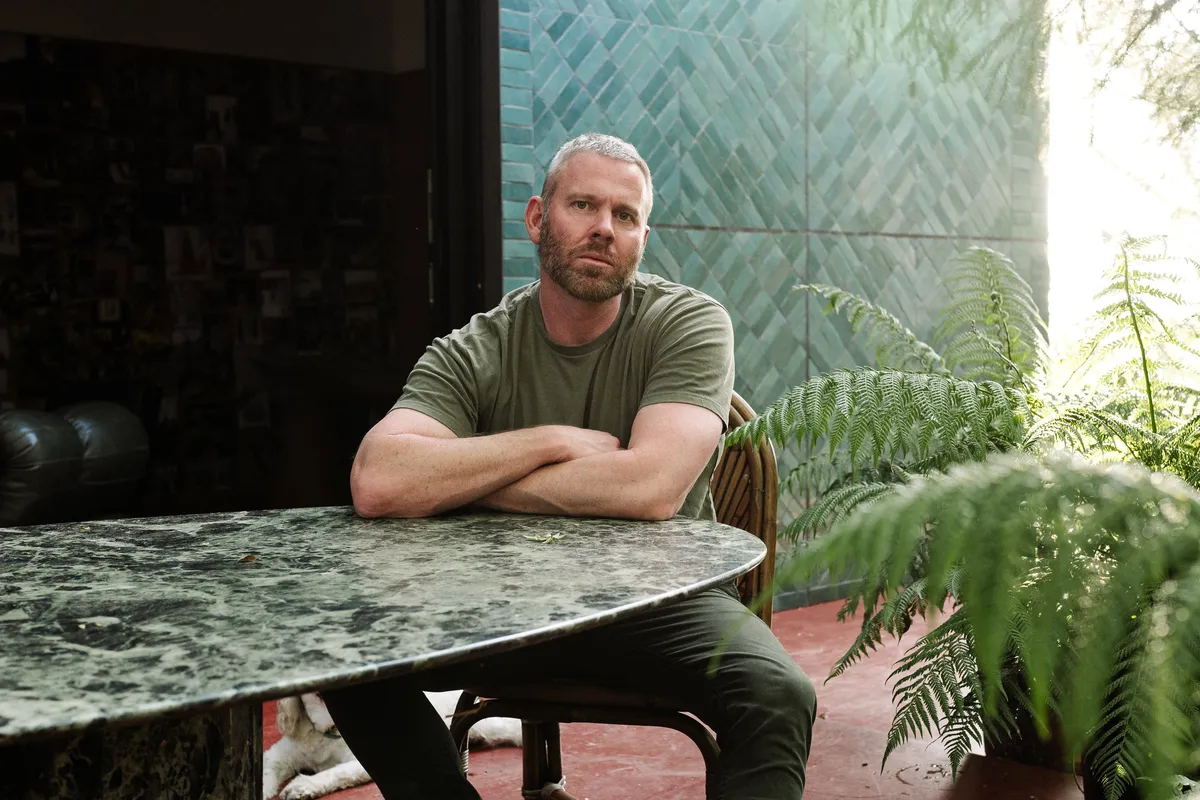 Richard Christiansen of Flamingo Estate in a natural, sunlit setting, possibly holding a product.