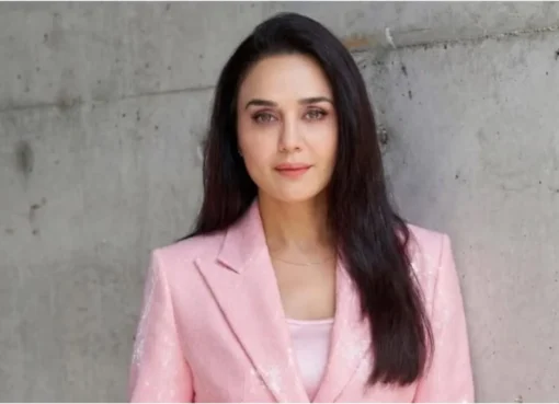 Preity Zinta, smiling but with a hint of exhaustion, looking thoughtfully as if recalling long shoot days.
