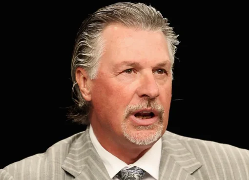 Photo of Barry Melrose on the ice.