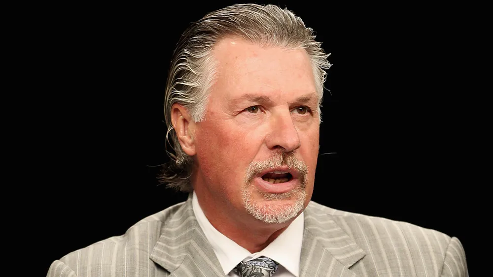 Photo of Barry Melrose on the ice.