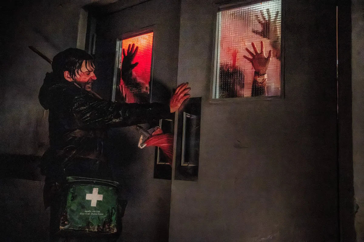A dark and atmospheric scene from a horror movie with red lighting