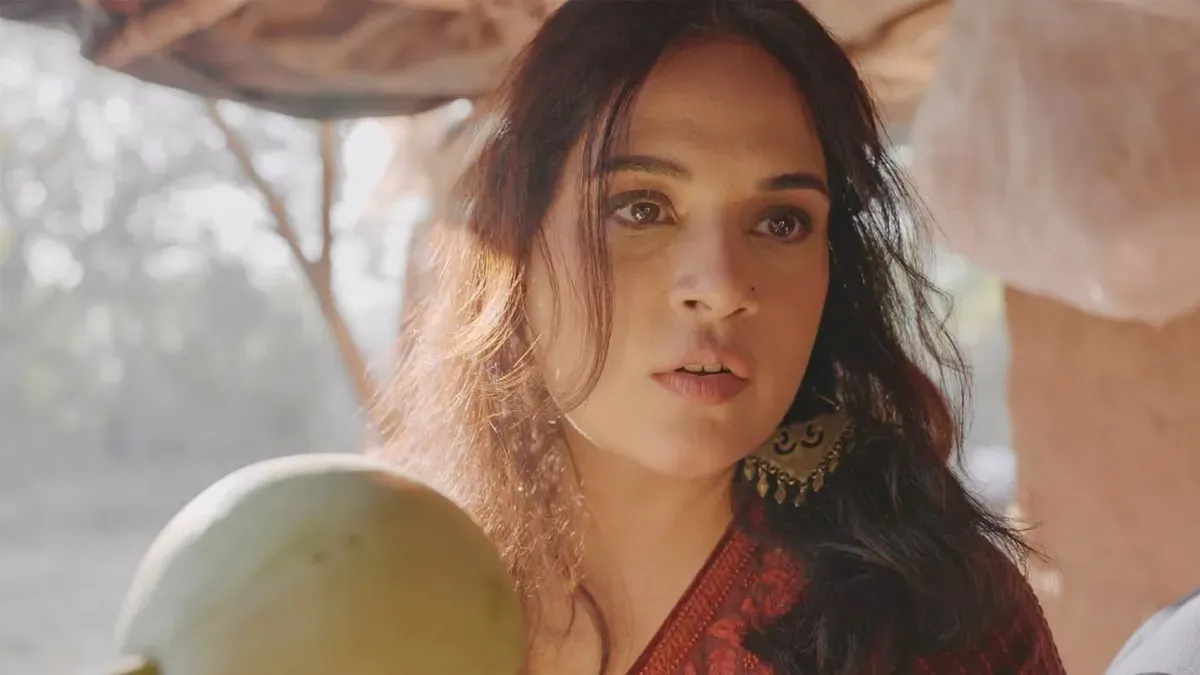 Richa Chadha smiling while unveiling the trailer for her new travel series, Musafiri.
