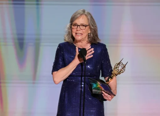 Sally Field accepting an award on stage at the Emmys.