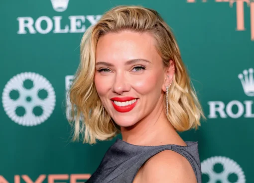 Scarlett Johansson smiling on the red carpet at the New York Film Festival.