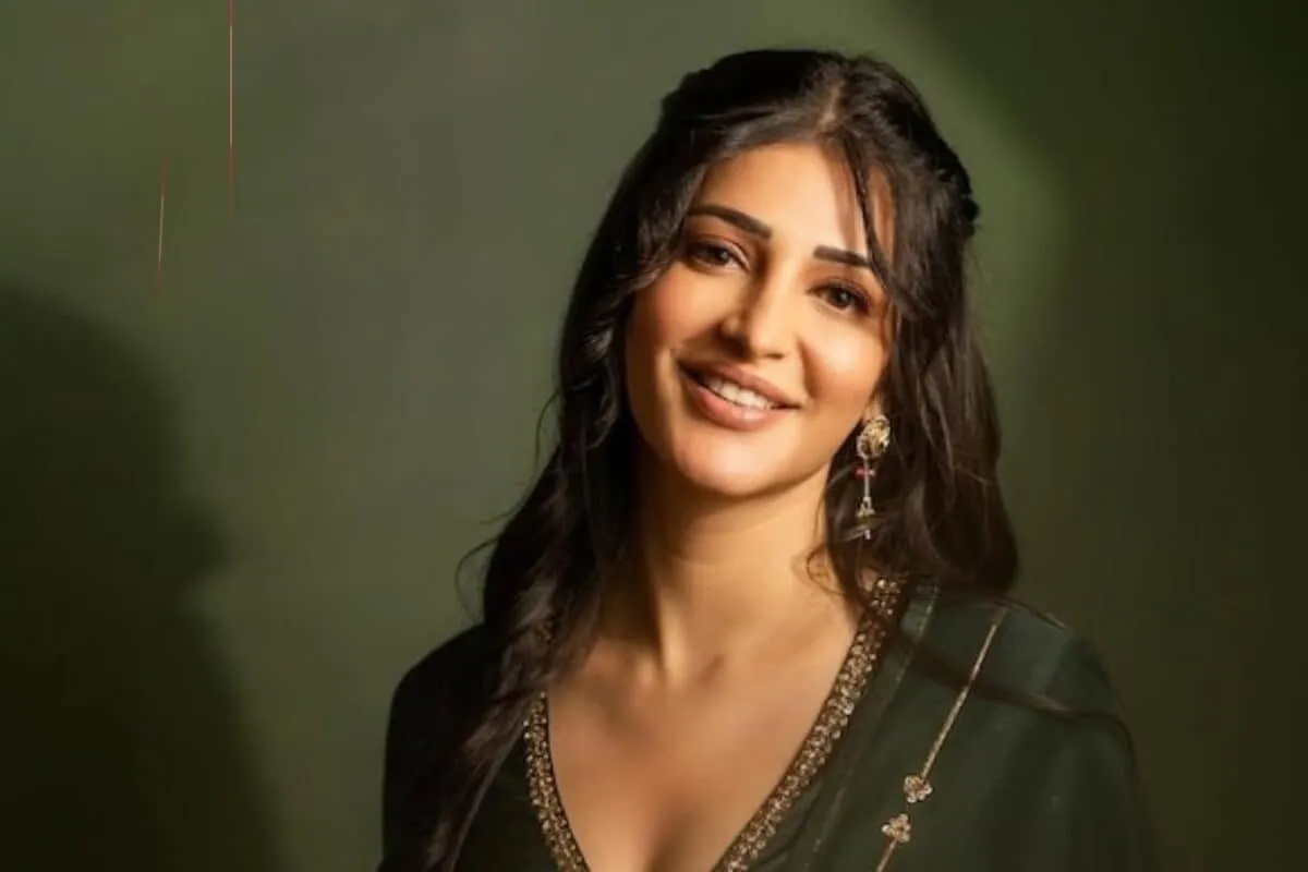 Shruti Haasan posing in a stylish dark outfit