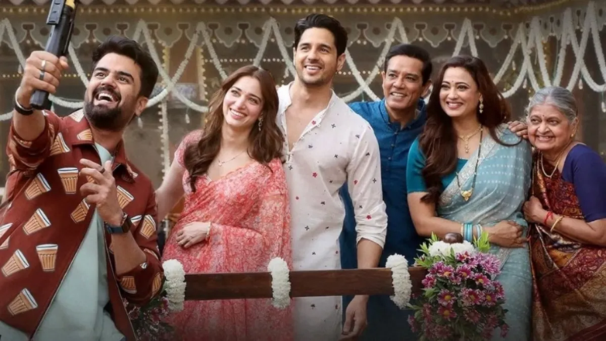 Sidharth Malhotra and Tamannaah Bhatia smiling at a movie event.