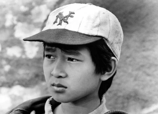 Ke Huy Quan as a child actor on a movie set.