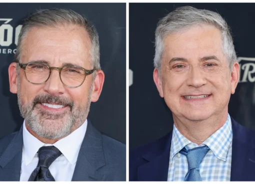 Steve Carell smiling, with a subtle Olympic ring logo in the background, suggesting a biopic.