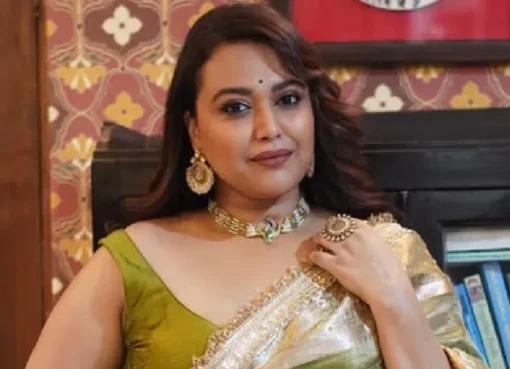 Swara Bhasker looking serious and speaking into a microphone.