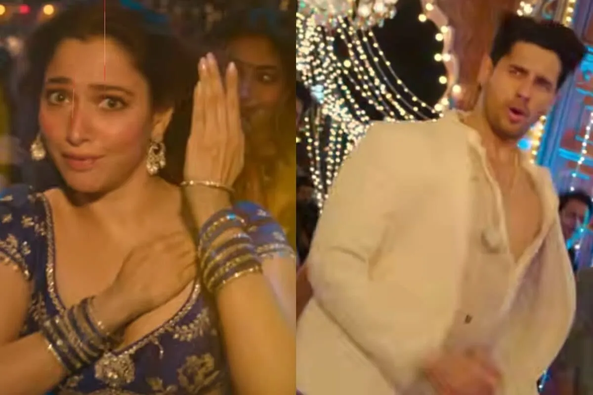Tamannaah Bhatia and Sidharth Malhotra dancing together with high energy in a colorful setting from the Thummak Thummak music video.