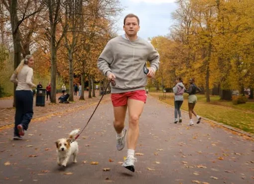 Taron Egerton looking charming but with a hint of mischief.