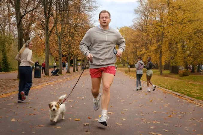 Taron Egerton looking charming but with a hint of mischief.