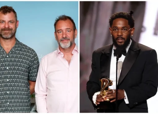 Trey Parker, Matt Stone, and Kendrick Lamar smiling together, possibly discussing their movie project.