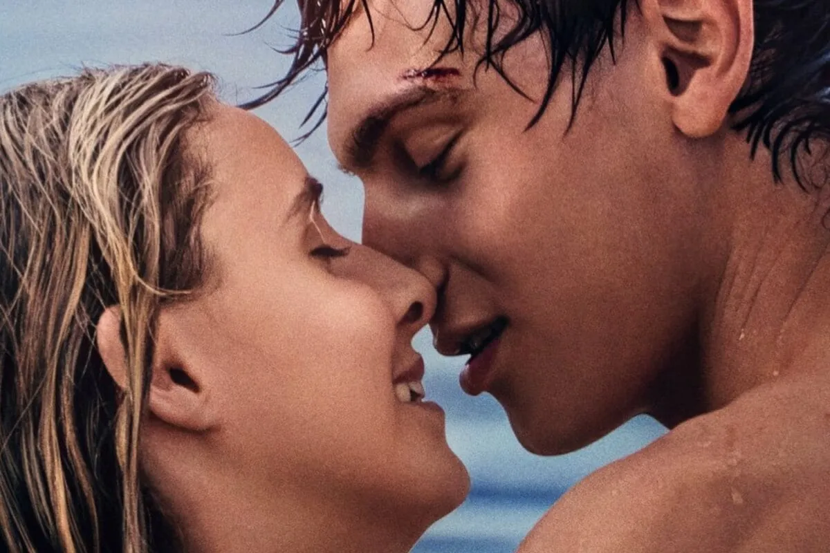 A moody scene from a young adult romance film on a laptop screen