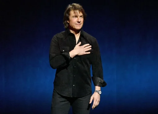 Tom Cruise looking confident on a talk show.