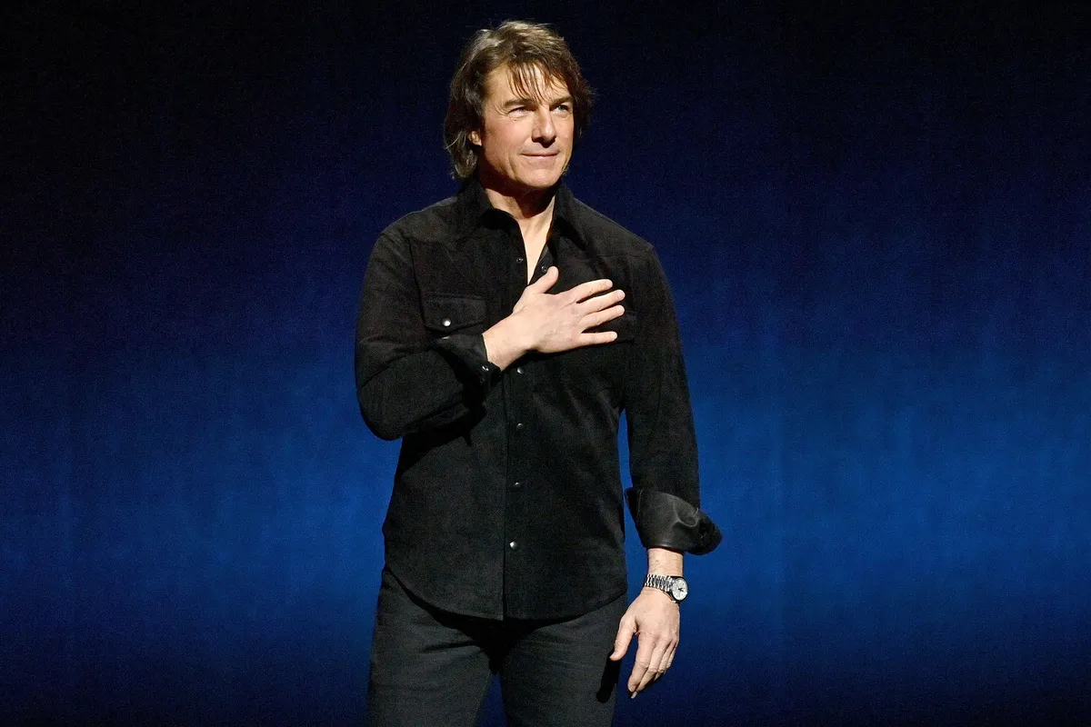 Tom Cruise looking confident on a talk show.