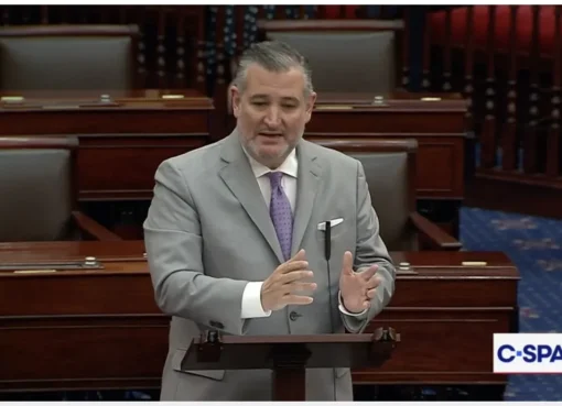Senator Ted Cruz speaking at a podium.