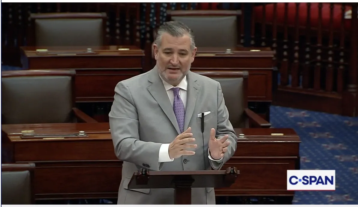 Senator Ted Cruz speaking at a podium.