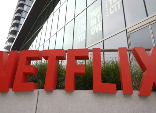 Netflix logo on a screen with a slight price tag overlay, representing a price increase.