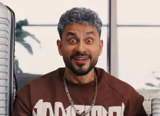 Kunal Kemmu smiling in a movie poster for 'Vibe'.