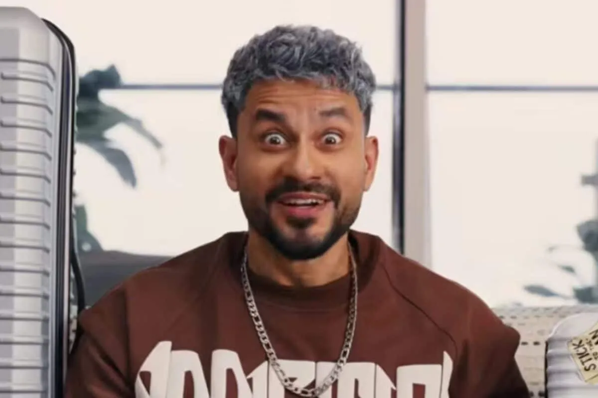 Kunal Kemmu smiling in a movie poster for 'Vibe'.