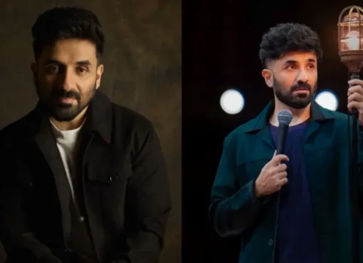 Vir Das smiling on a comedy stage.