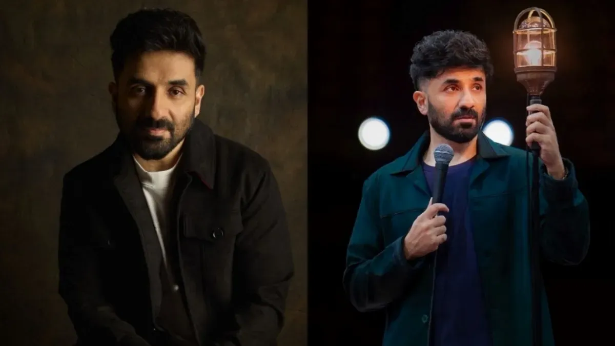 Vir Das smiling on a comedy stage.