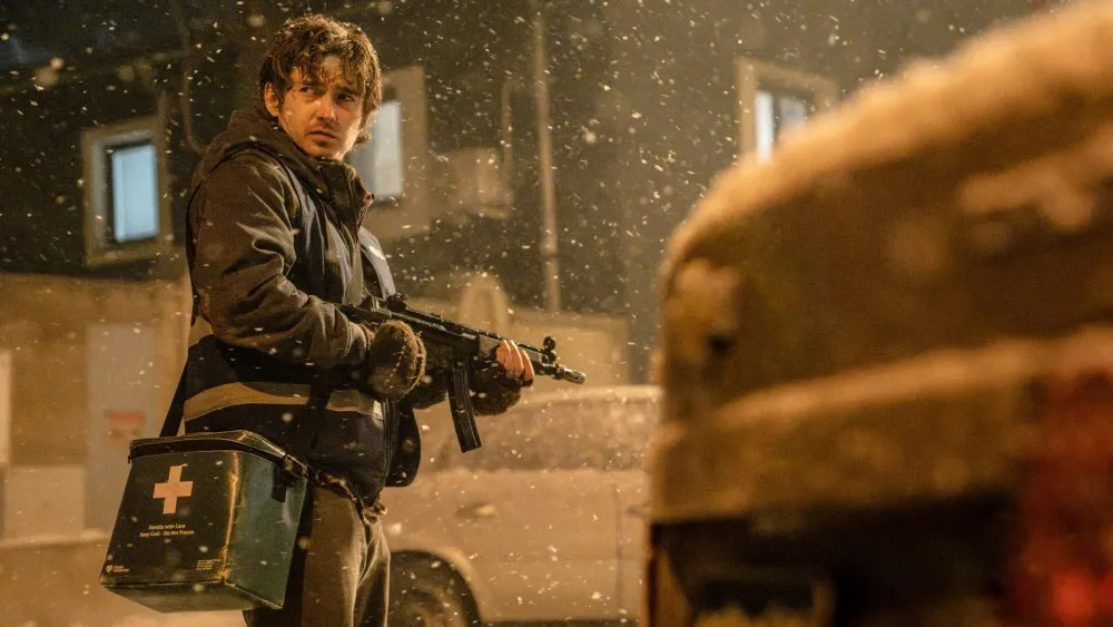A still from the movie 'Resident Evil' showing zombies or a scary scene.